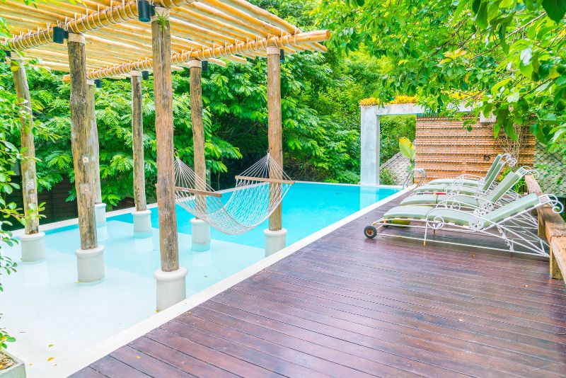 Pool decking installed around a Perth backyard pool
